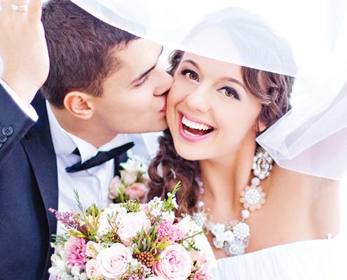 Young couple with Invisalign aligners getting married