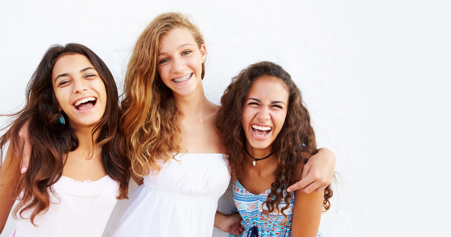 Teenage with braces learns her friends both have Invisalign aligners