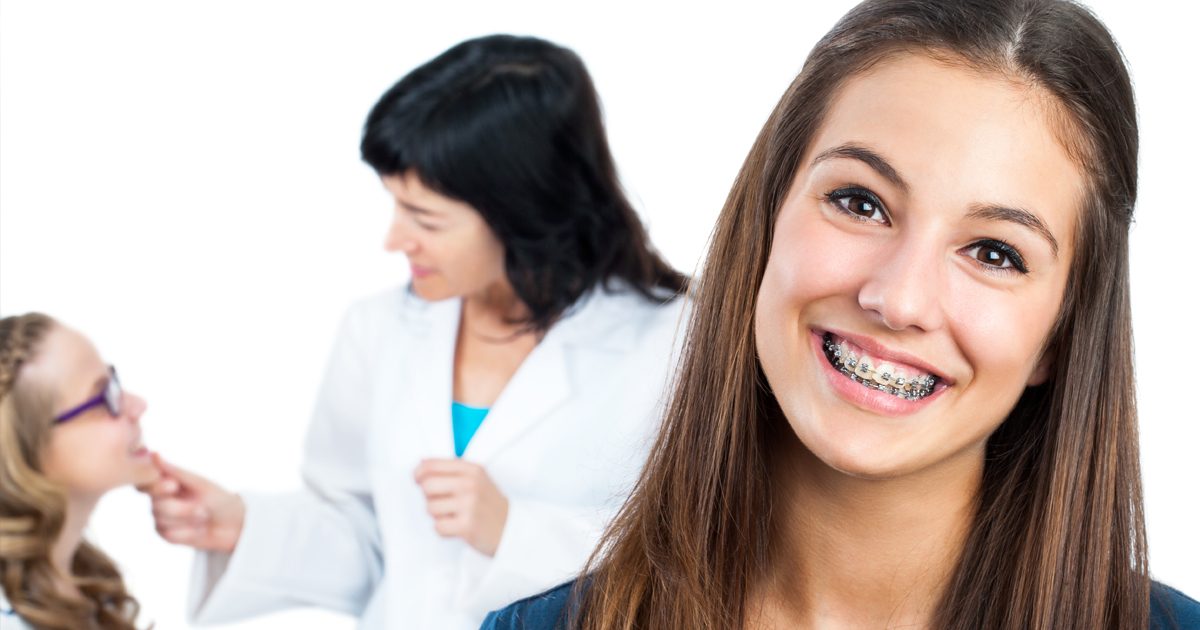 Teenager with braces visiting orthodontist in Asheville