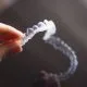 Invisalign: What's The Total Cost & Financing Options in WNC 6 After learning what Invisalign costs, woman gets her first aligner tray in Asheville