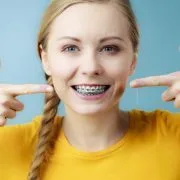 blue braces accessories colors asheville-min Woman who has gotten blue colored braces in Western North Carolina