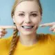 Blue Braces: How To Pick the Right Colors for Your Braces (And Make Your Teeth Look Whiter!) 13 Woman who has gotten blue colored braces in Western North Carolina