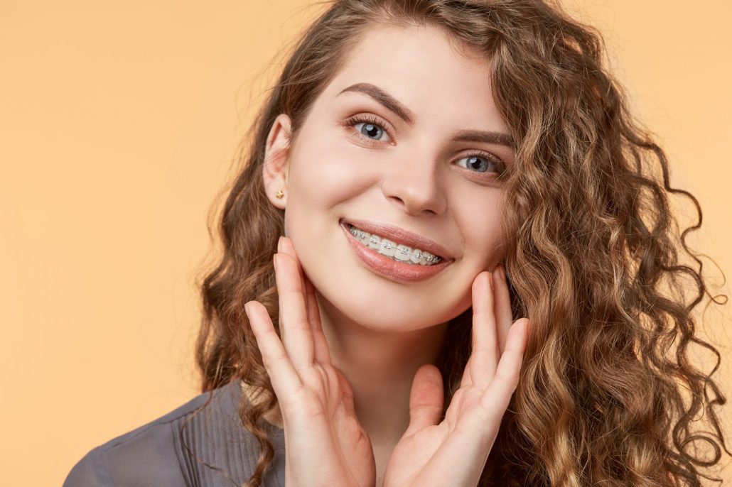 Woman gets ceramic braces from orthodontist in Asheville