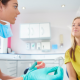 Woman learning about Impressions at-home invisible aligners during orthodontic consultation in Asheville