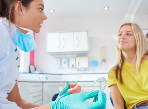 Woman goes to orthodontist for retainer replacement in Asheville