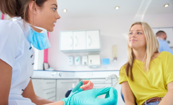 Woman goes to orthodontist for retainer replacement in Asheville