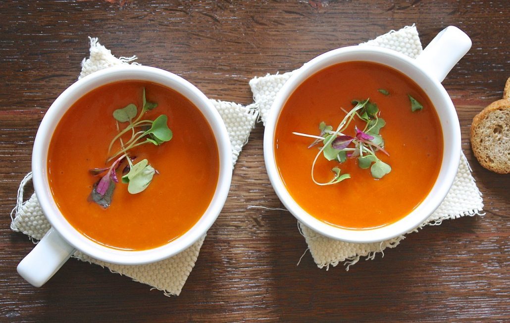 Person picks tomato soup to eat after oral surgery