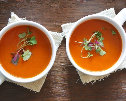 Person picks tomato soup to eat after oral surgery