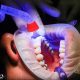 Person getting teeth whitened after braces in Asheville