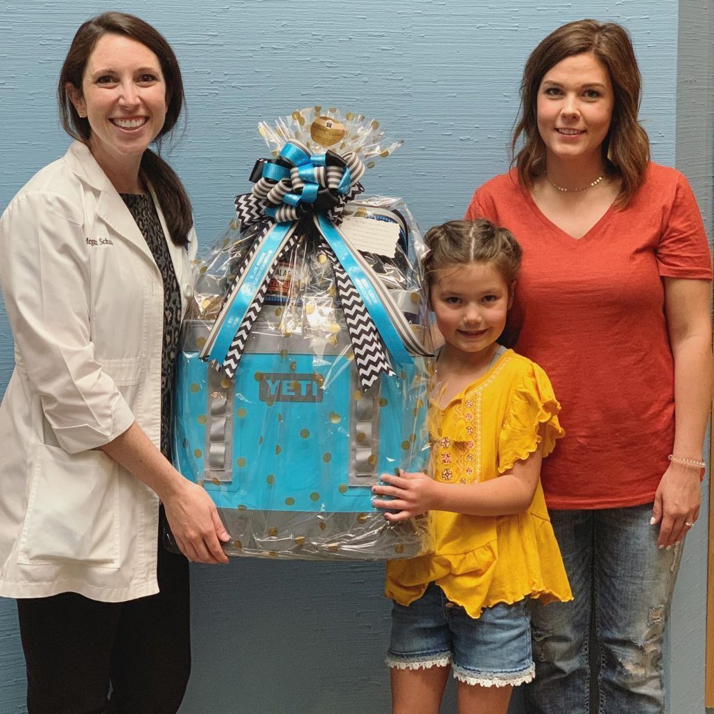 Dr. Schuler gives family Yeti gift basket in Asheville, NC