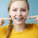 Woman with braces covered by dental insurance