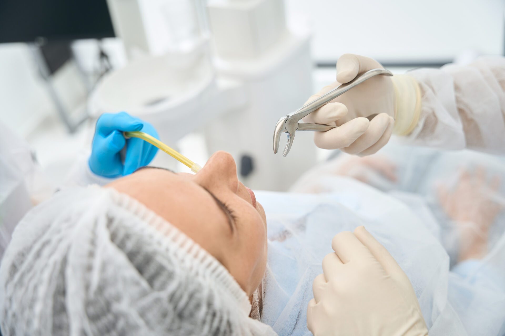 Woman in a dental chair on a tooth extraction